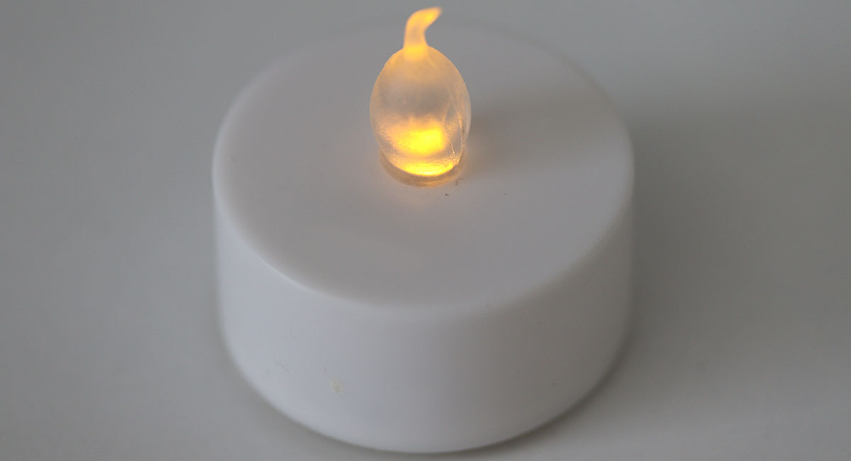 A battery operated candle lit up.