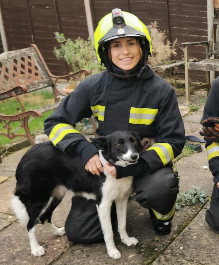 Image of female Firefighter with Chi Chi the dog