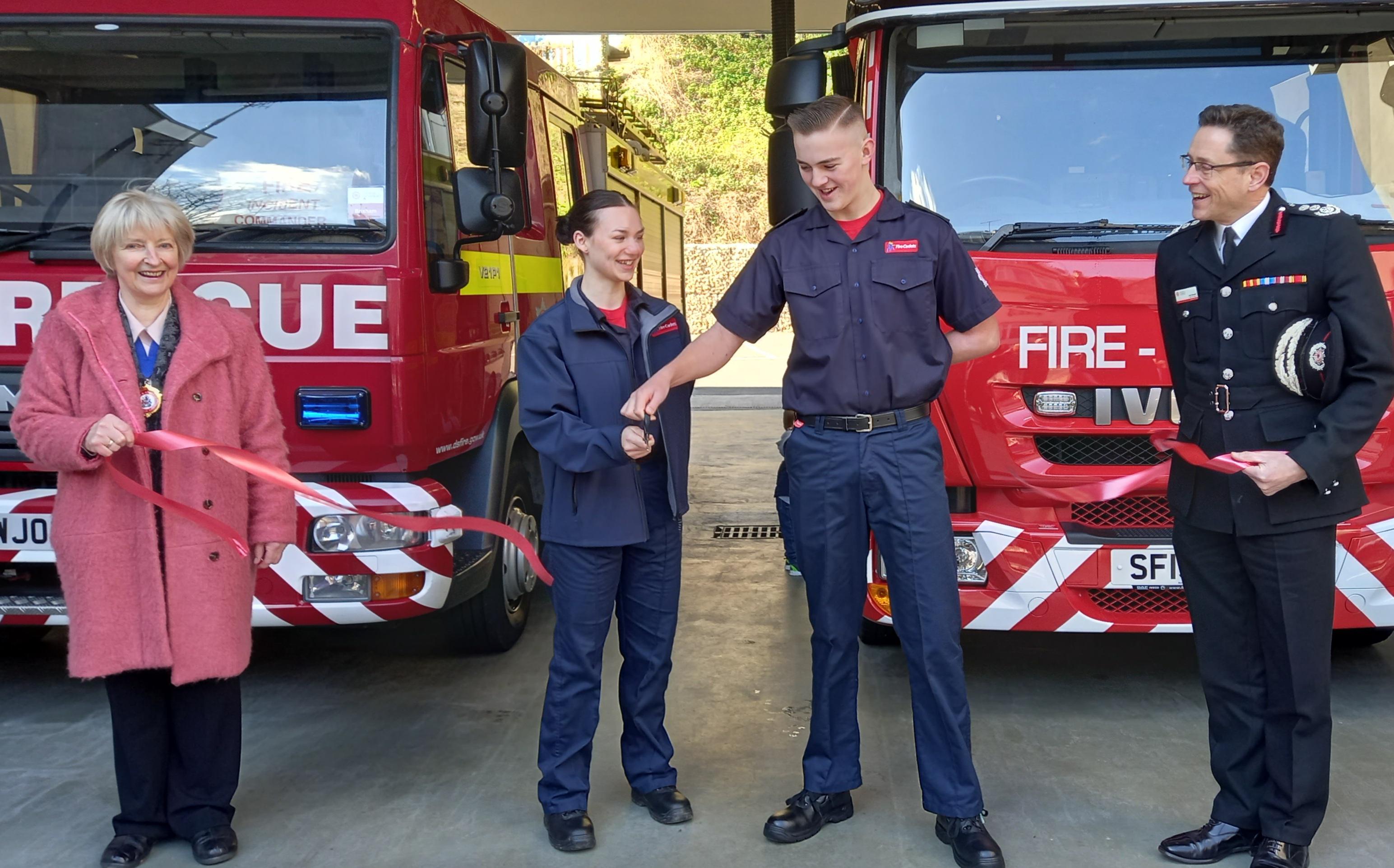 Cutting the opening ribbon for the new fire station