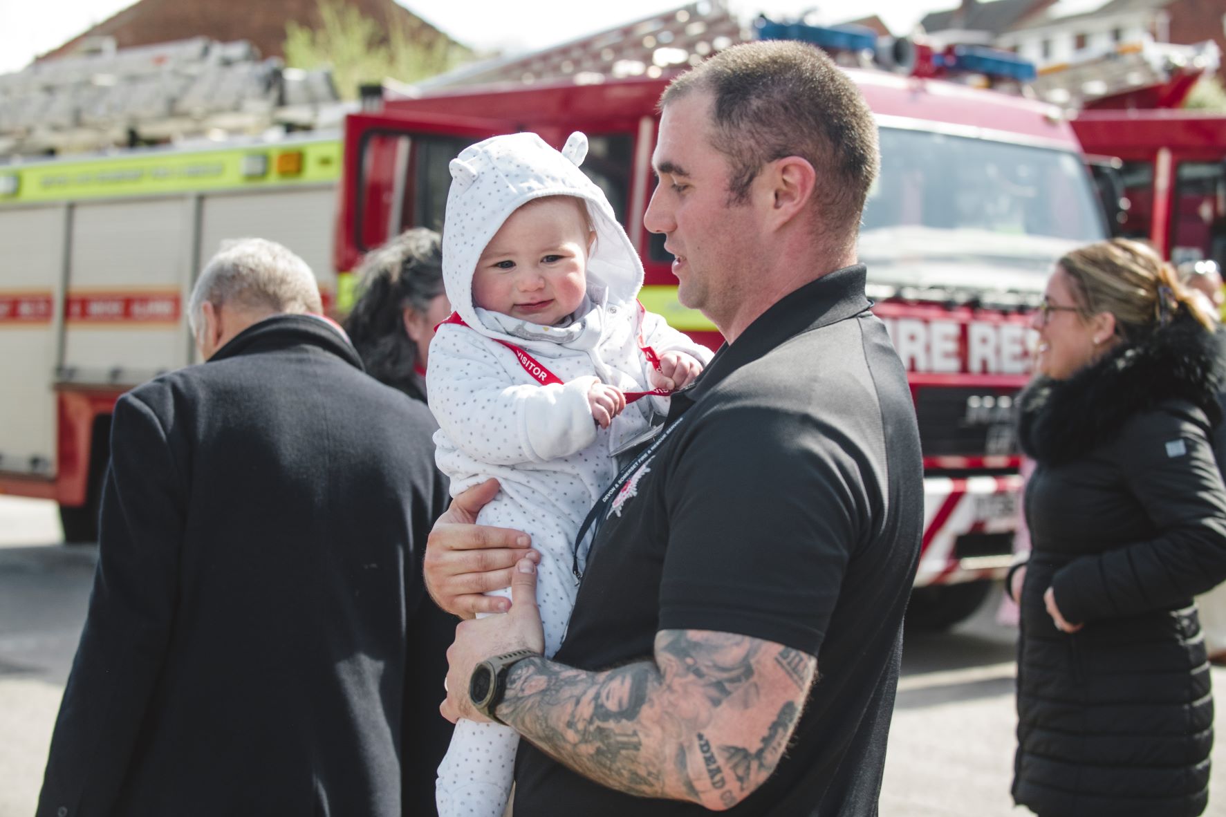 Firefighter holding a baby