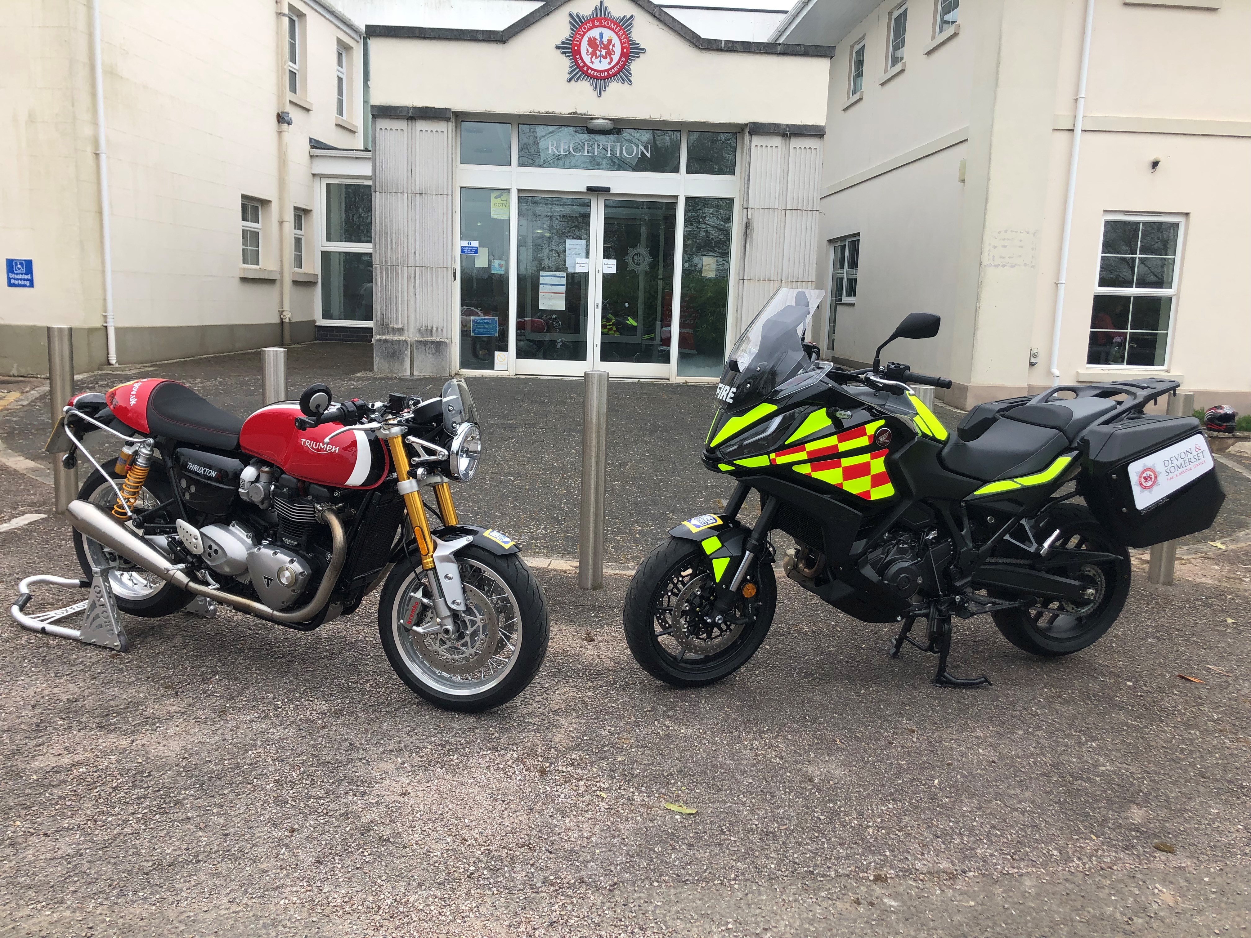 Two motorcycles parked outside fire service headquarters