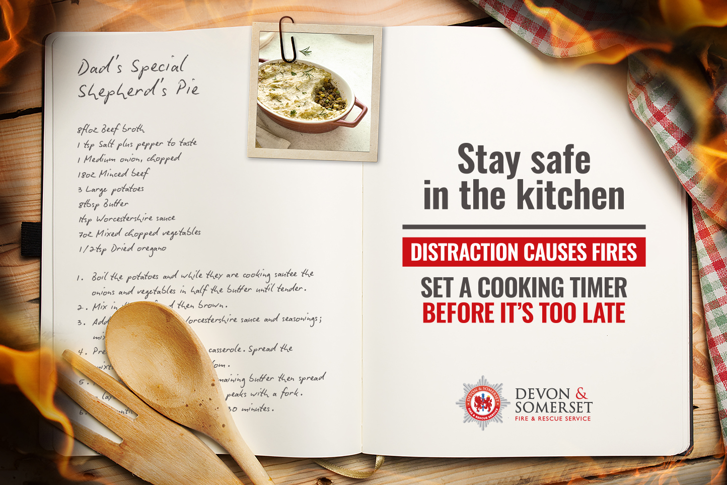 recipe book with 'dad's special shepherds pie' and a message to stay safe in the kitchen - distraction causes fires - set a cooking timer before it's too late