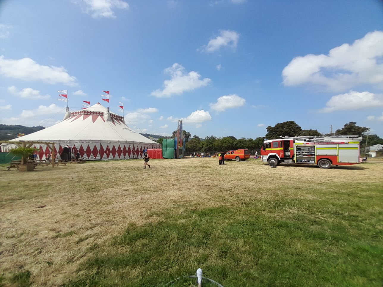 A fire engine near a circus tent at Glastonbury Festival