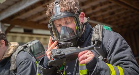 Anthony checking his breathing apparatus equipment