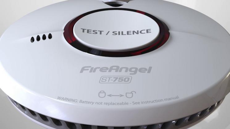 The Fire Angel smoke alarm. It's round and white, with test/silence written on a round button in the middle outlined by a red light.